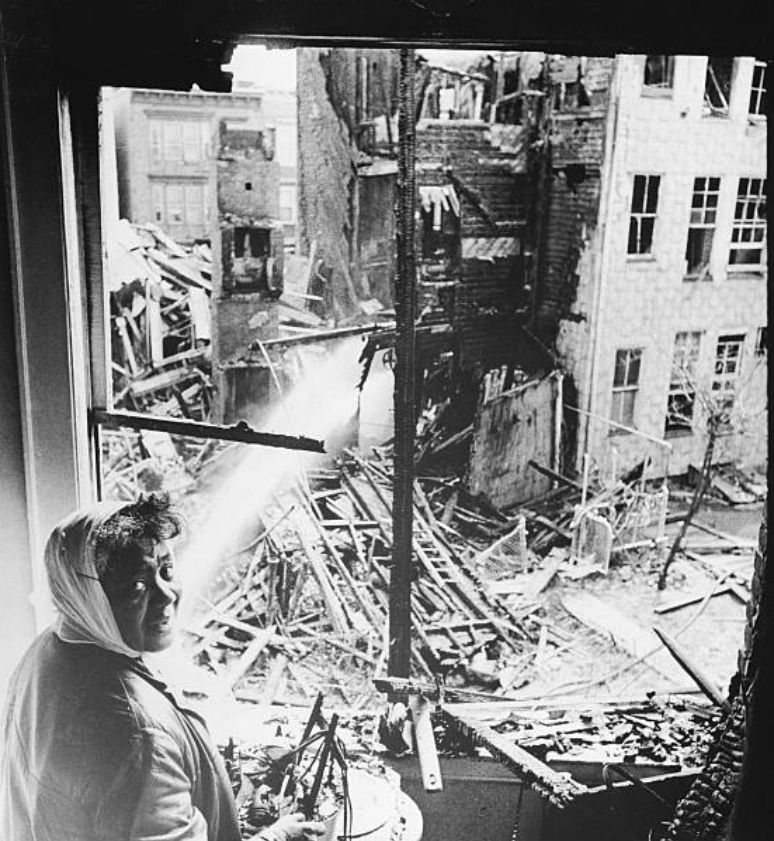 Mrs. Howard Thomas looking out her Central Ward window.
Photo from Bettmann
