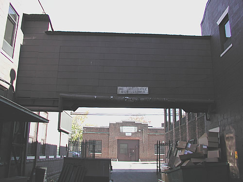 Annex Building as seen from alley, under walkway bridge
