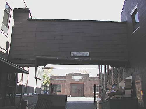 Annex Building as seen from alley, under walkway bridge
