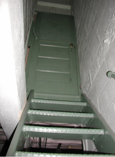 Stairway up old elevator shaft
