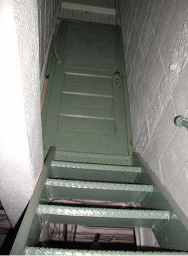 Stairway up old elevator shaft
