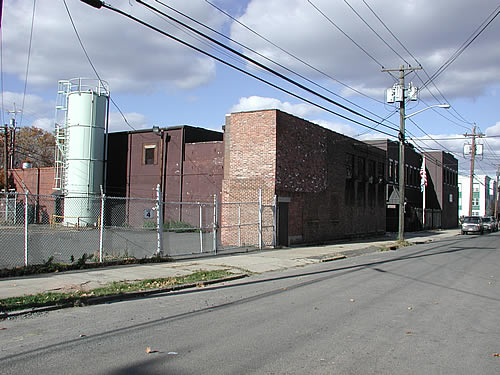 Main Plant Building with green Plastic Silo
