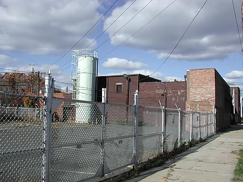 Main Plant Building with green Plastic Silo
