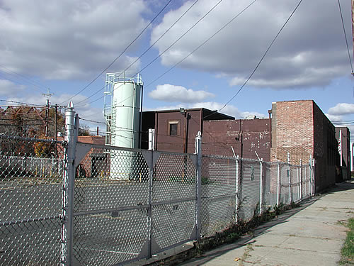 Main Plant Building with green Plastic Silo
