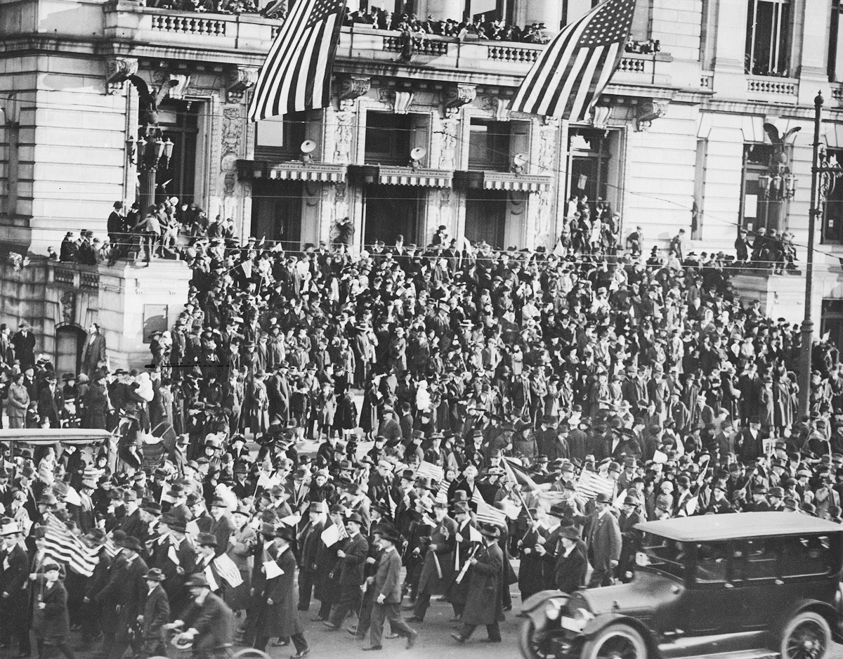 1918
Foreign born workmen passing the City Hall the day the Armistice was signed.
Photo from the National Archives
