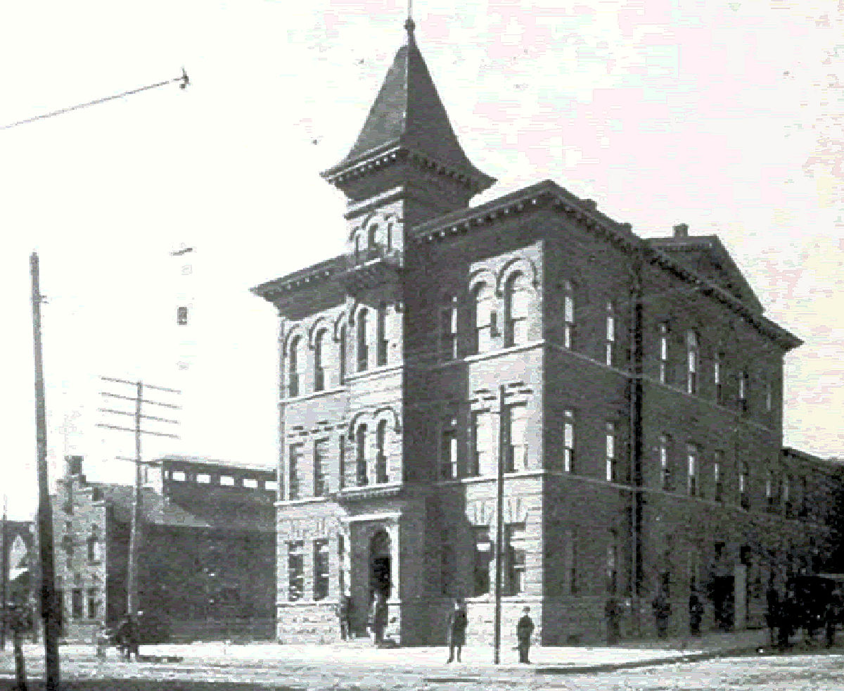 Building on the left side of the photo
The Summer Avenue Bath House is the building on the left and the 2nd Precinct police station is on the right.

From "Essex County, NJ, Illustrated 1897" 
