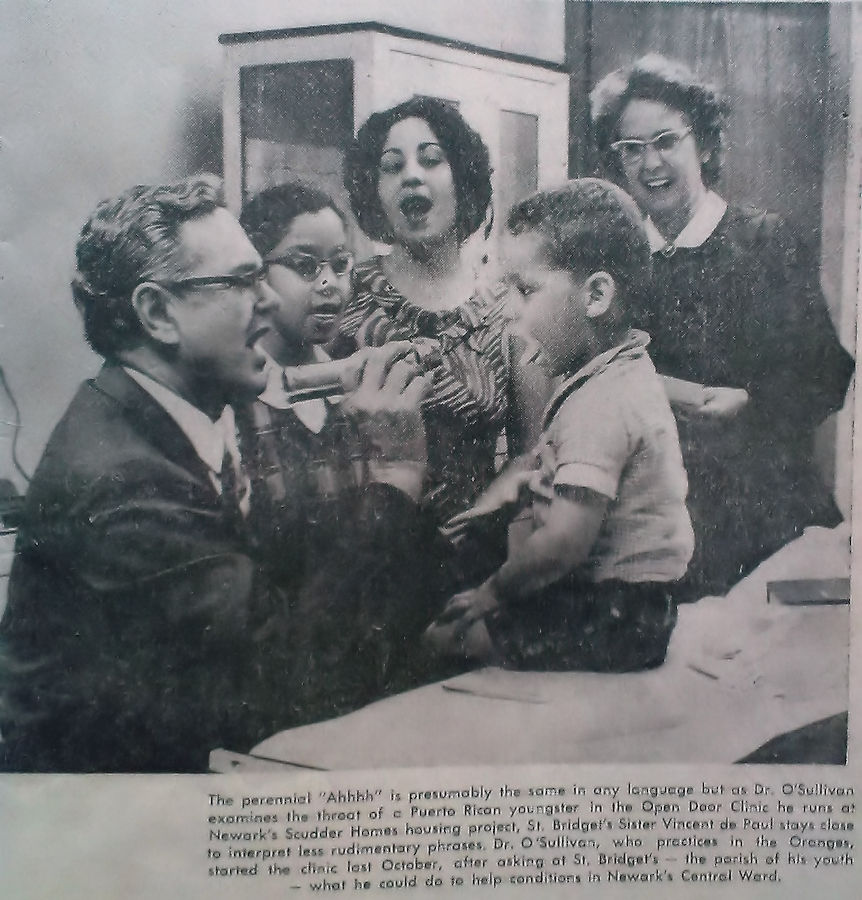 Dr. O'Sullivan examining a child
Open Door Clinic at the Scudder Homes
Photo from Jean O'Sullivan
